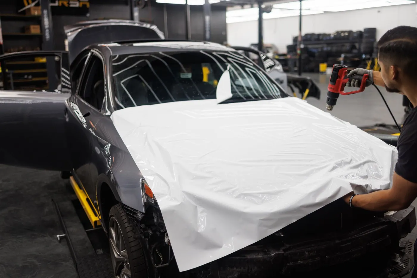 Detailer working on a vehicle
